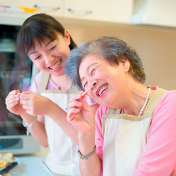 Women doing housework in domestic kitchen